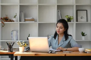 asian-business-woman-using-laptop-computer-at-office